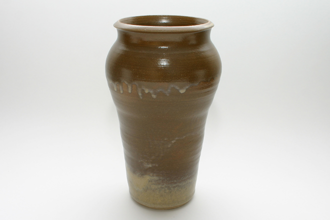 <span style="font-size:14px">10" Brown Stoneware Vase</span><br><br> hand thrown stoneware with gloss brown glazed exterior, a lighter brown glaze around the exterior base, and gloss brown glazed interior<br><br>approximately 10" tall, 5-1/2" diameter, 3-7/8" diameter opening, 3-3/4" diameter base<br><br>Item Number 003 . . . . . . . . . . . $75.00<br><br><span style="font-size:9px"><div style="line-height:1.4em;">Shipping and handling costs will be added prior to purchase.</div></span><br><br><span style="font-size:12px">Select the "Add to Cart" button below to purchase this item.</span><br><br><form target="paypal" action="https://www.paypal.com/cgi-bin/webscr" method="post"> <input type="hidden" name="cmd" value="_s-xclick"> <input type="hidden" name="hosted_button_id" value="PJXLW75X75GFE"> <input type="image" src="https://www.paypalobjects.com/en_US/i/btn/btn_cart_LG.gif" border="0" name="submit" alt="PayPal - The safer, easier way to pay online!"> <img alt="" border="0" src="https://www.paypalobjects.com/en_US/i/scr/pixel.gif" width="1" height="1"> </form> <br> <br> <form target="paypal" action="https://www.paypal.com/cgi-bin/webscr" method="post"> <input type="hidden" name="cmd" value="_cart"> <input type="hidden" name="business" value="G22CMPZLDZBR6"> <input type="hidden" name="display" value="1"> <input type="image" src="https://www.paypalobjects.com/en_US/i/btn/btn_viewcart_LG.gif" border="0" name="submit" alt="PayPal - The safer, easier way to pay online!"> <img alt="" border="0" src="https://www.paypalobjects.com/en_US/i/scr/pixel.gif" width="1" height="1"> </form>