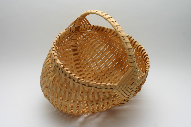 <span style="font-size:14px">EGG BASKET</span><br>S. Westfield<br><br>natural cane with a cane-wrapped oak handle and oak rim<br><br>approximately 11" tall, 12" wide, 10" diameter opening